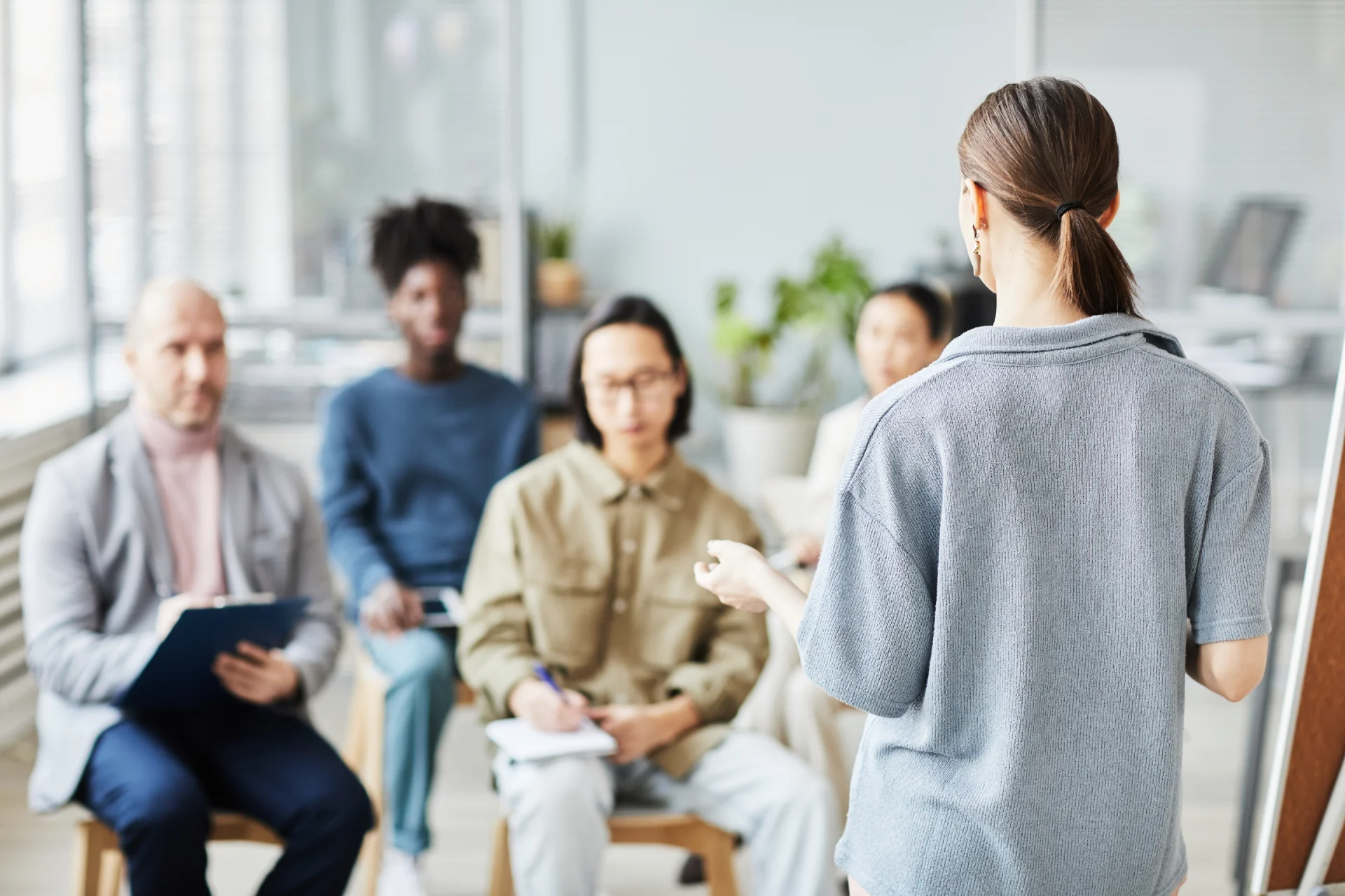 A professional setting on Long Island with people gathered for an group therapy session